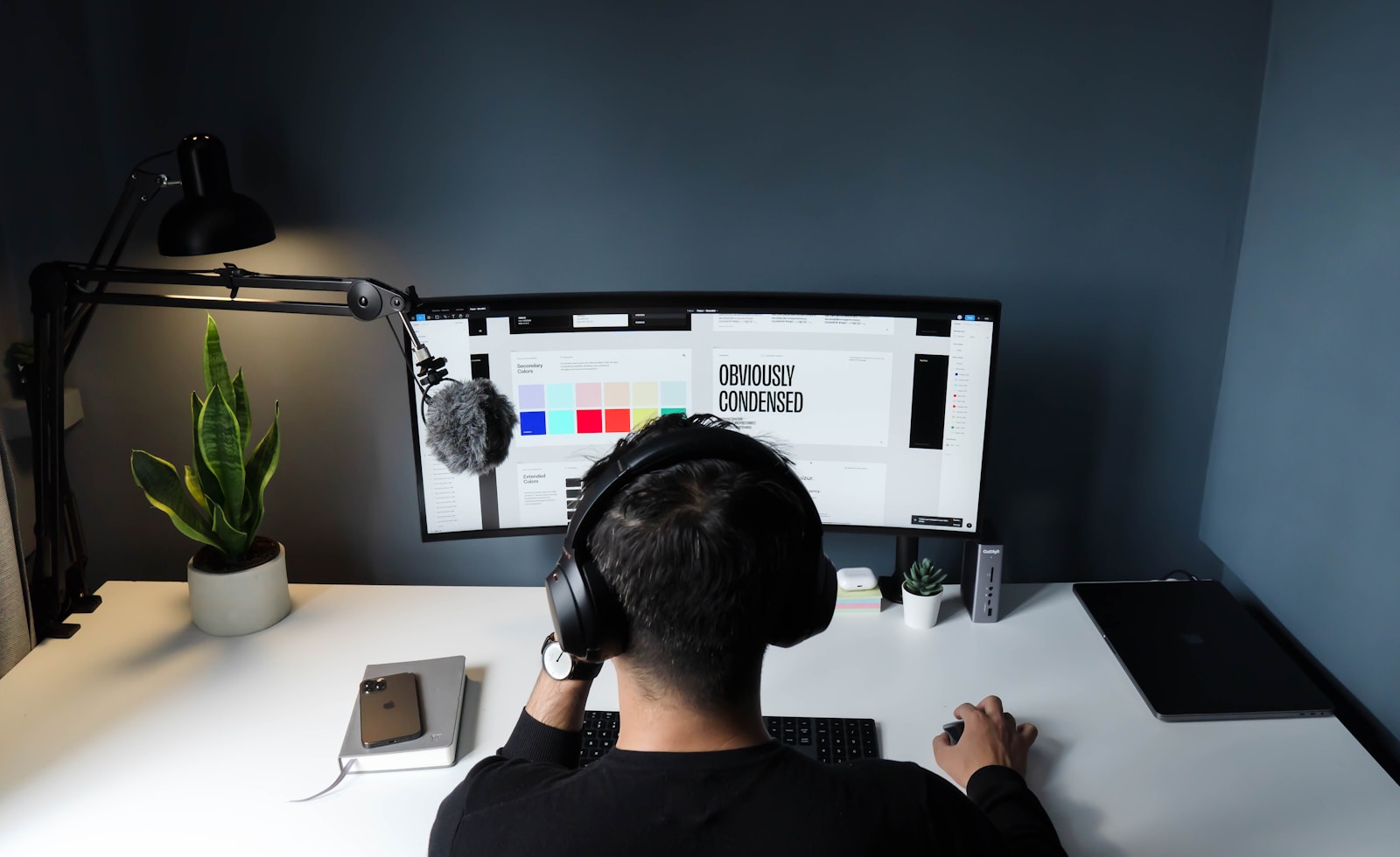 man in black shirt sitting in front of computer 5 Reasons to Invest in (Branding and Identity Design Services) During a Rebrand