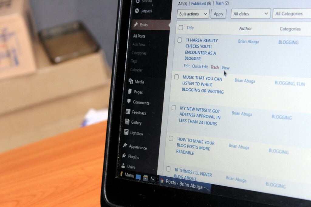 Time to Hire a WordPress Developer: Why DIY Stops Scaling Your Business 2 a laptop computer sitting on top of a wooden desk