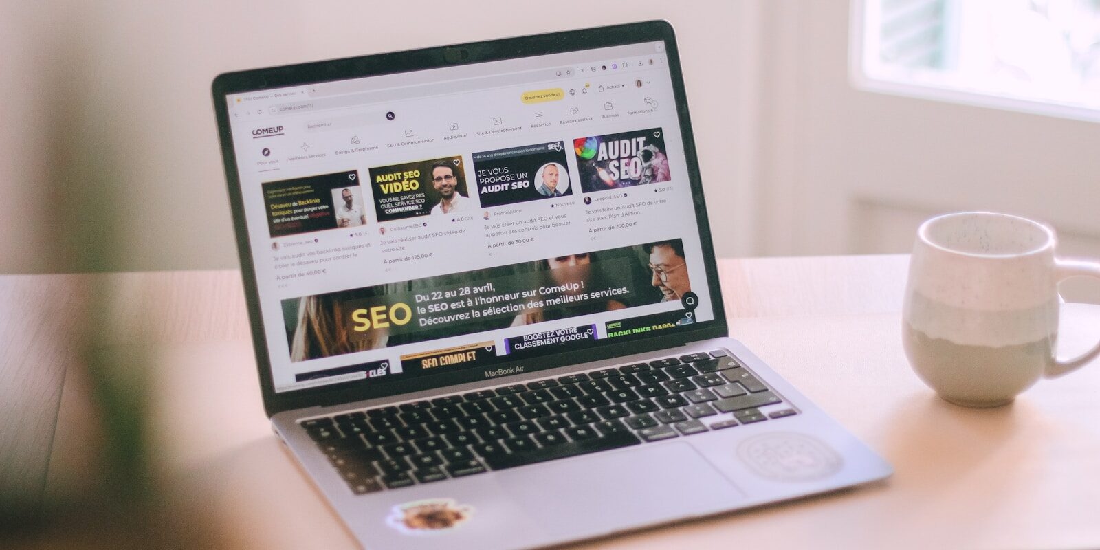A laptop computer sitting on top of a wooden table 10 Local SEO Services Every Small Business Should Use in 2026
